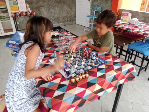 Kids playing board games at Hangdong Minigolf Chiang Mai German Restaurant family activity