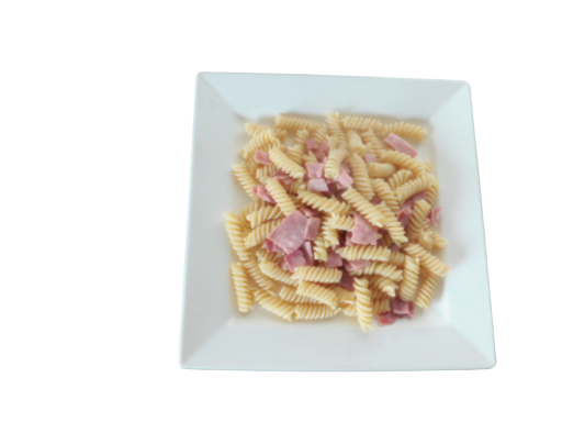 Plate of pasta with pieces of ham in a creamy sauce.