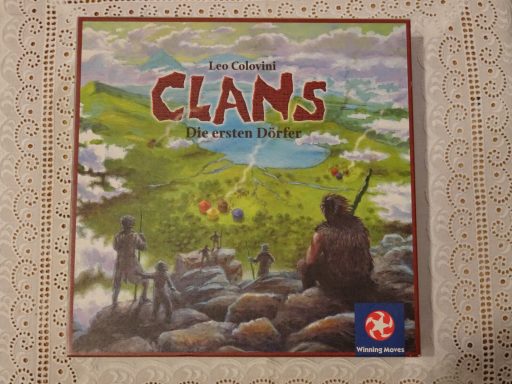 Board game "Clans" featuring a scenic landscape with characters and colorful game pieces.
