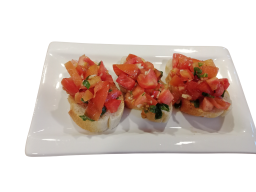 Three pieces of bruschetta topped with diced tomatoes and herbs on a white plate.